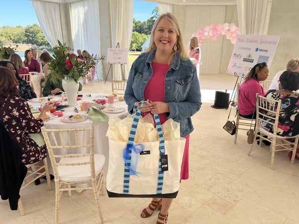 woman with large bag at women's fundraiser