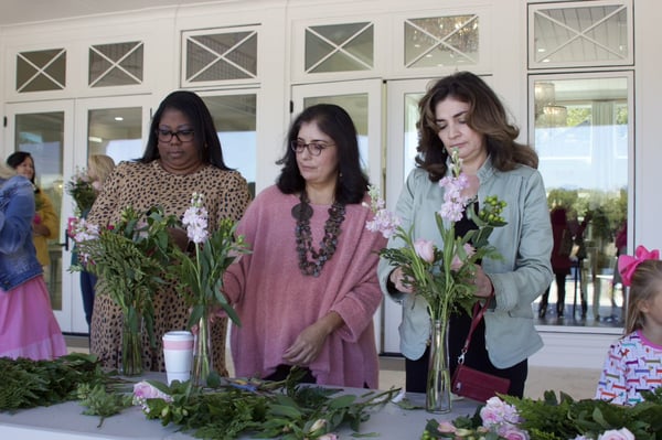 women making bouquets at fundraiser