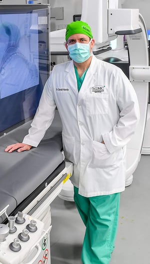 SGMC's Dr Hardy posing with imaging machine