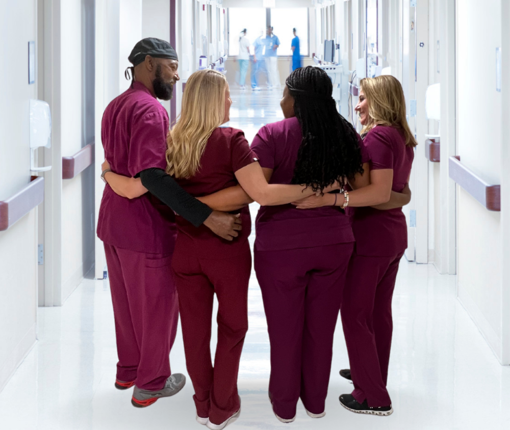 nurses standing together in hospital hallway